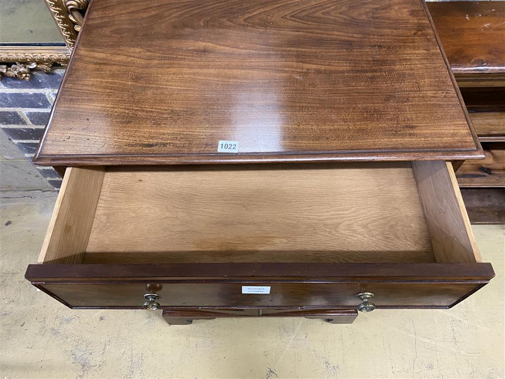 A Regency mahogany cupboard, fitted four drawers over a pair of fielded panelled doors (altered), width 69cm, depth 56cm, height 104cm